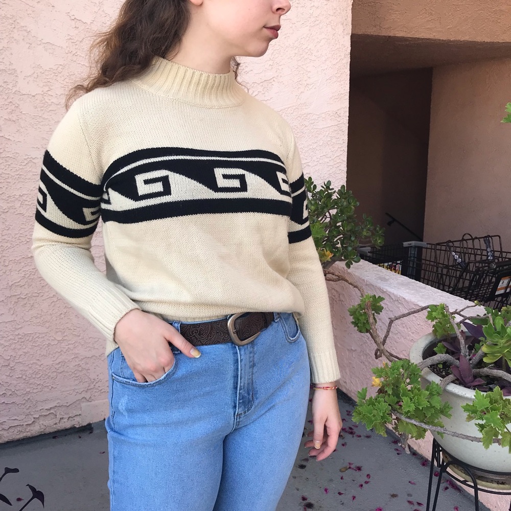 Mock neck cream colored sweater with black details
